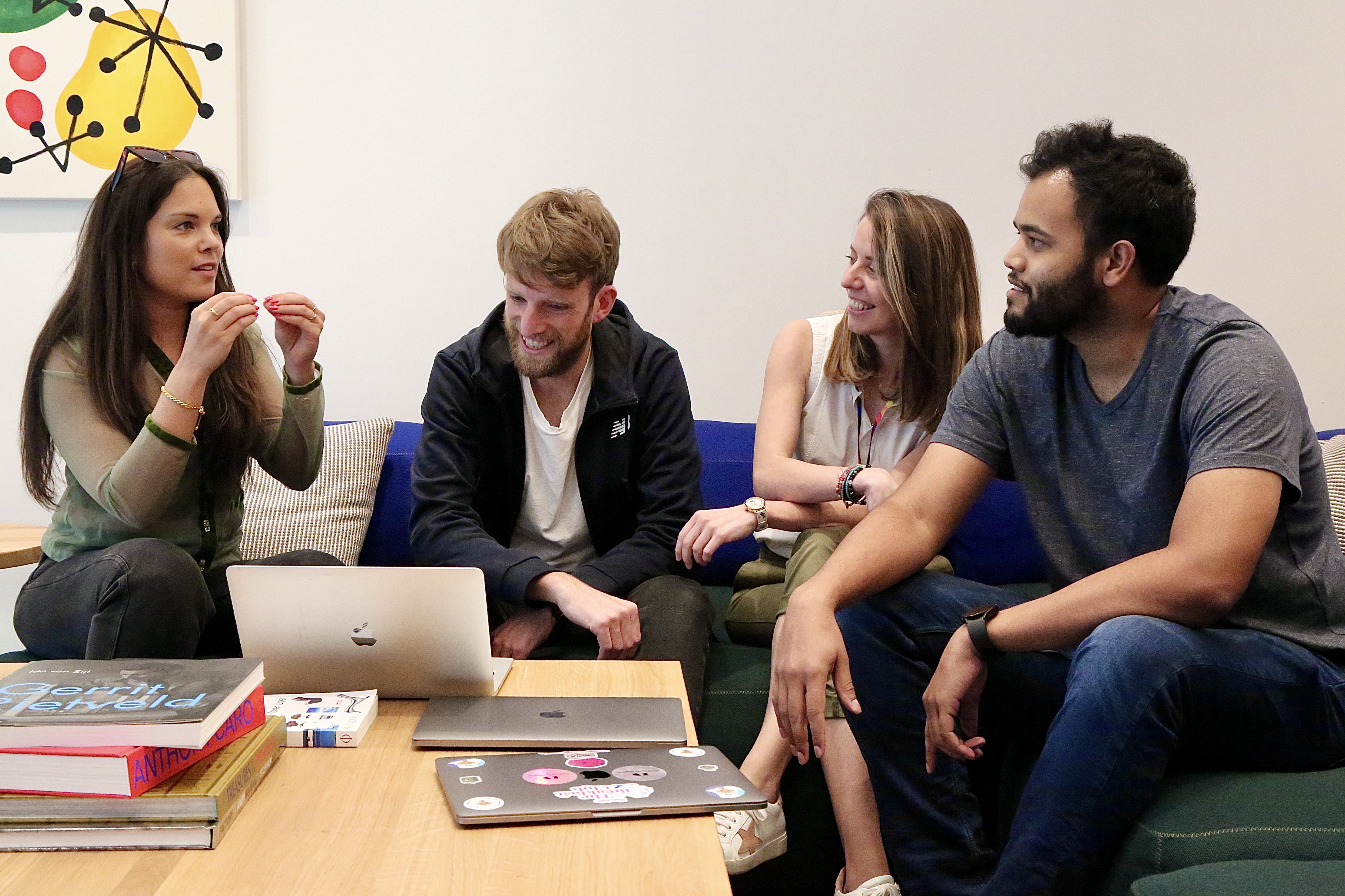 Group of colleagues in a meeting smiling